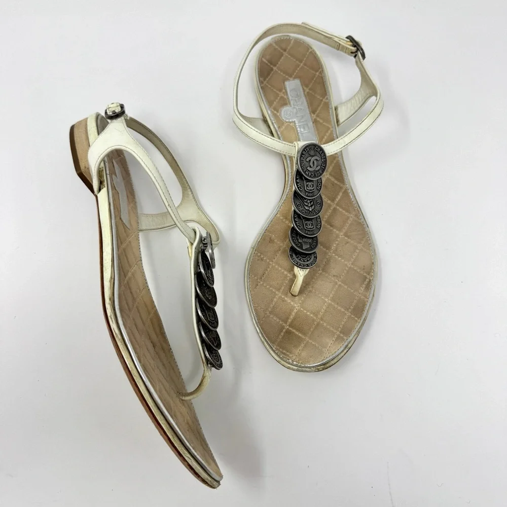 CHANEL White Leather Thong Sandals with Stacked Silver Coin Medallions